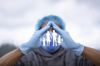 Image of a Winnipeg doctor making a hand gesture symbolizing the protection of a family through life insurance coverage